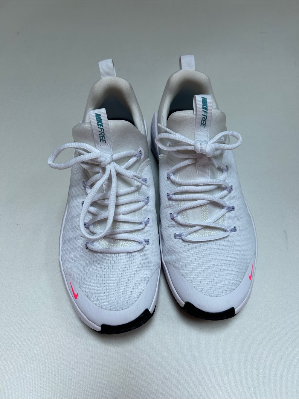 Nike Women's White Athletic Sneakers with Pink Accent